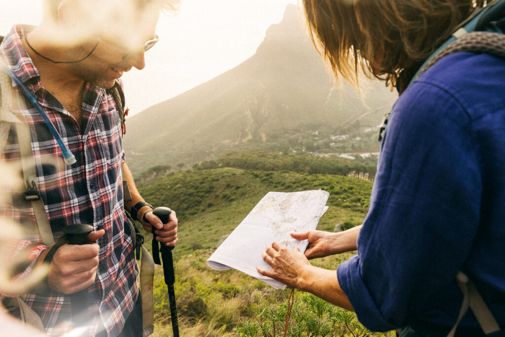hiker looking at a map on table mountain