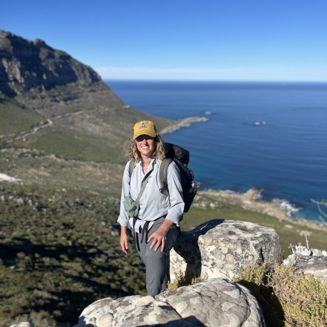 female standing on mountain