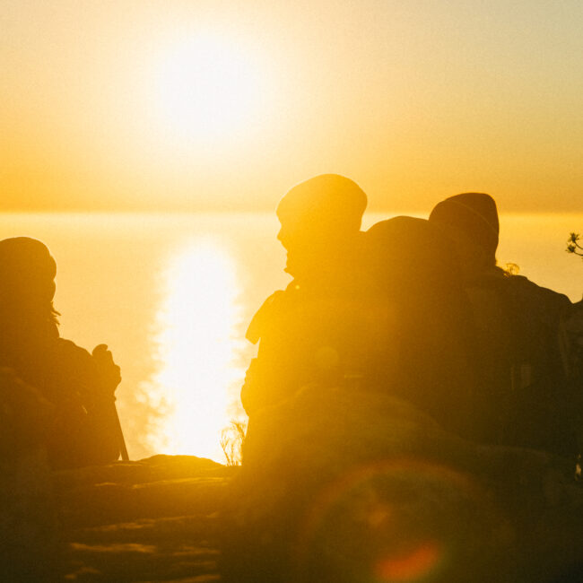 hikers enjoying the sunset on the mountain