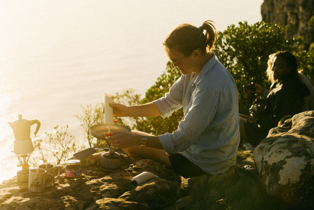woman making pancakes on the mountain