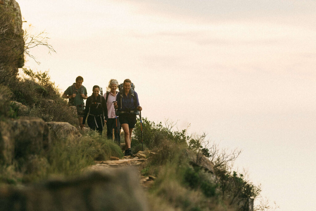 four hikers walking along Table Mountain