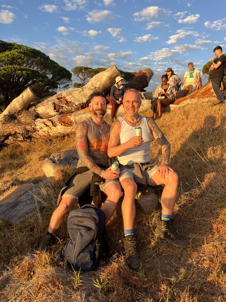 two gay men enjoying the sunset on Table Mountain
