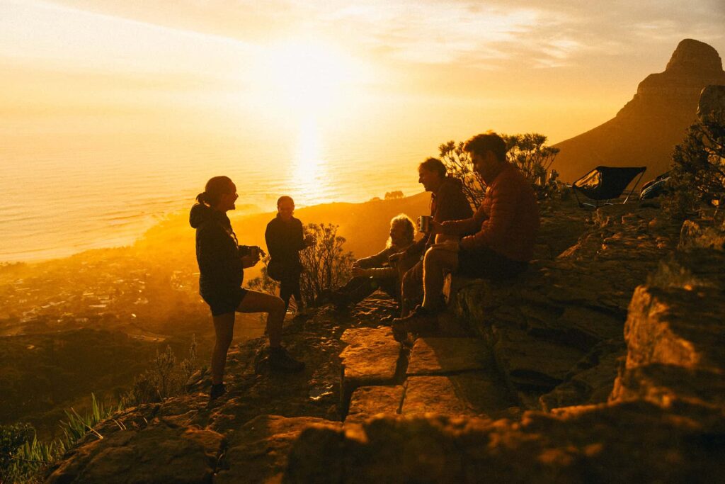 hikers enjoying the sunset on table mountain