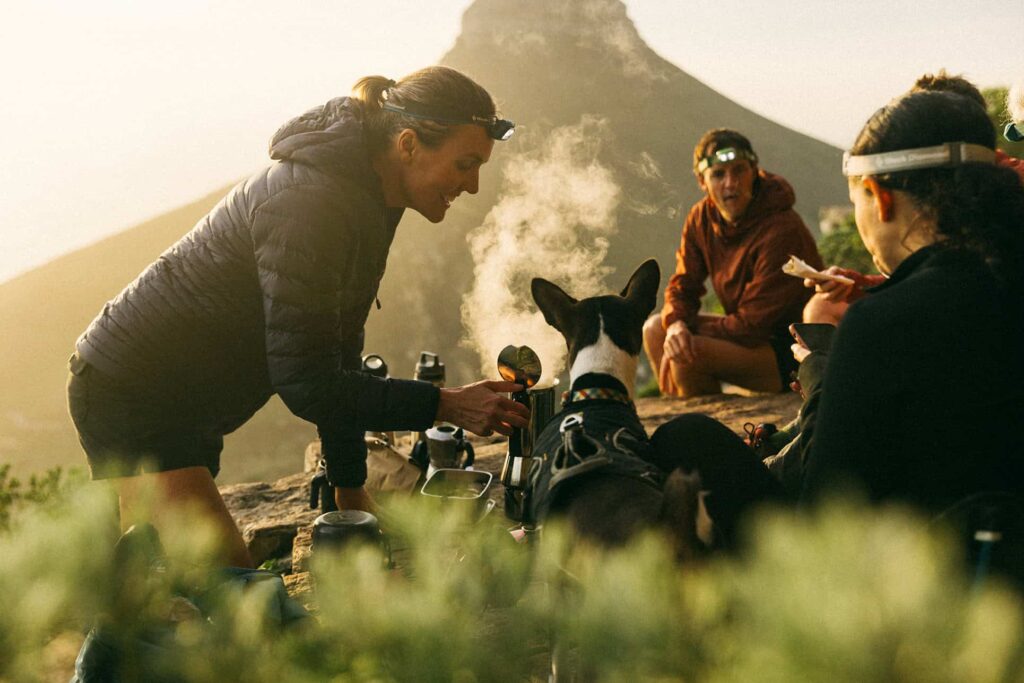 hiker making coffee on table mountain